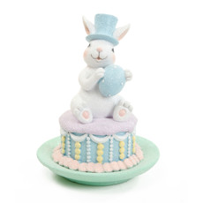 Imagem de COELHO DECORATIVO SENTADO NO BOLO COLORIDO EM RESINA 15X12X12 CM - CROMUS - Cromus Embalagens Ind. E Com. Ltda